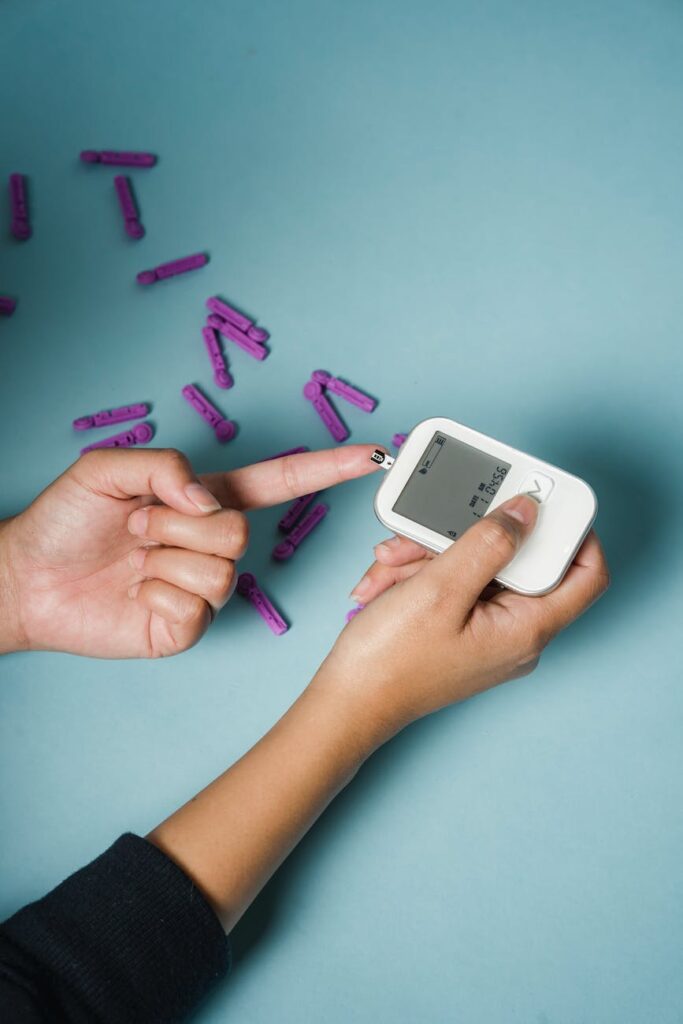 woman checking blood sugar with glucometer
